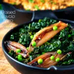 Braised cavolo nero with peas and shallots served with veggie crumble featuring a title overlay.