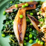 Braised cavolo nero with peas and shallots.