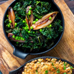 Overhead Braised cavolo nero with peas and shallots.