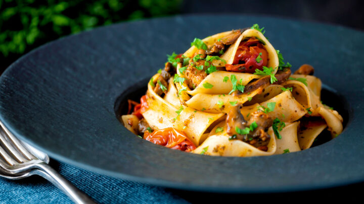 Chorizo pasta with pappardelle, tinned cherry tomatoes and mushrooms.