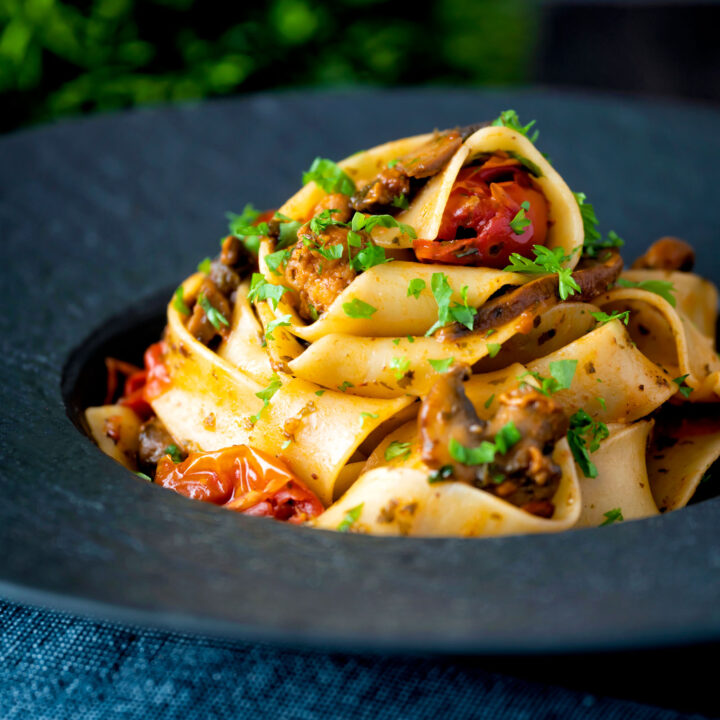 Chorizo pasta with pappardelle, tinned cherry tomatoes and mushrooms.