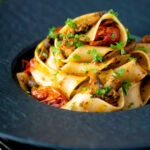 Chorizo pasta with pappardelle, tomatoes and mushrooms.