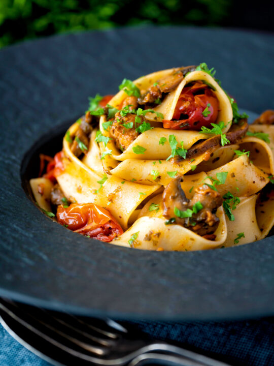 Chorizo pasta with pappardelle, tomatoes and mushrooms.