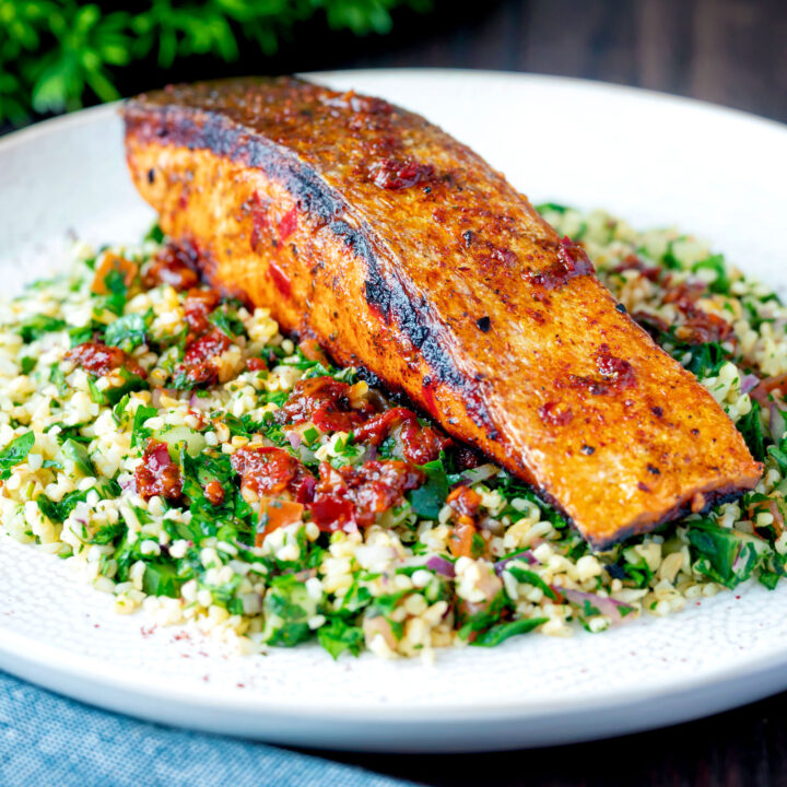 Crispy skinned pan fried harissa salmon fillet served with herby tabbouleh salad.