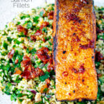 Close up pan fried harissa salmon fillet served with tabbouleh salad featuring a title overlay.