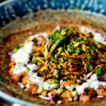 Keema rice served with kachumber salad and mint raita.