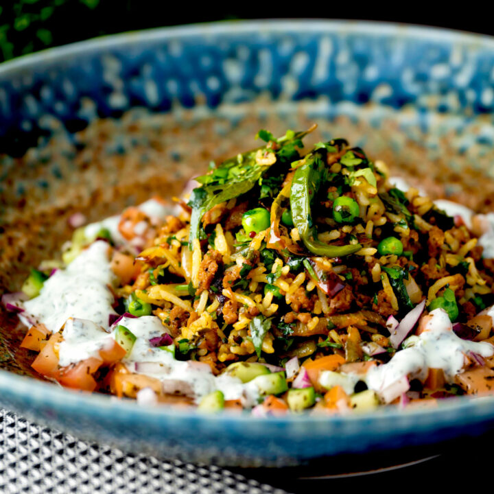 Keema rice or keema chawal served with kachumber salad and mint raita.