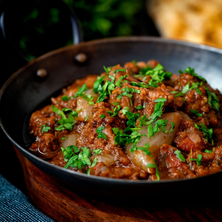British Indian restaurant inspired lamb bhuna curry served in an iron karahi.