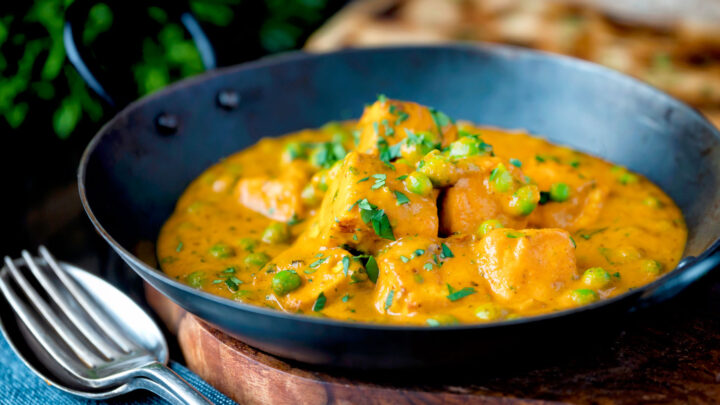 Matar paneer curry or mutter paneer served in an iron kadai.