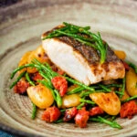 Pan fried hake with chorizo, new potatoes and samphire.