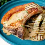 Close up pork chops with griddled pears and cider tarragon sauce.