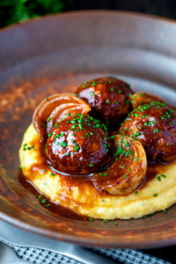 Pork meatballs in a beer BBQ sauce served on cheesy polenta.