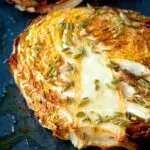 Close up roasted savoy cabbage with fennel seeds.