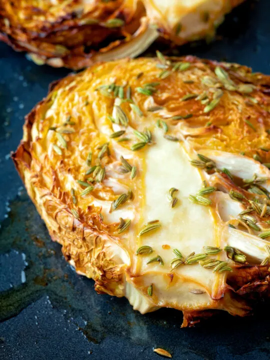 Close up roasted savoy cabbage with fennel seeds.