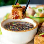 Salt and pepper tofu dipped into a soy and chilli dipping sauce.