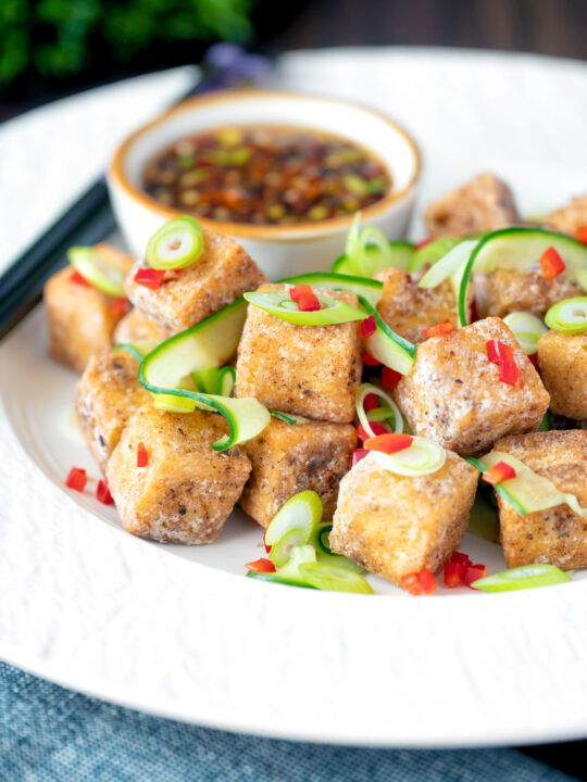 Salt and pepper tofu with a chilli soy dipping sauce and pickled cucumber.