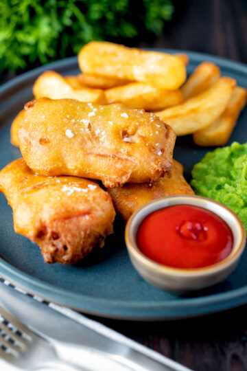 Crispy spam fritters served with chips, mushy peas and ketchup.