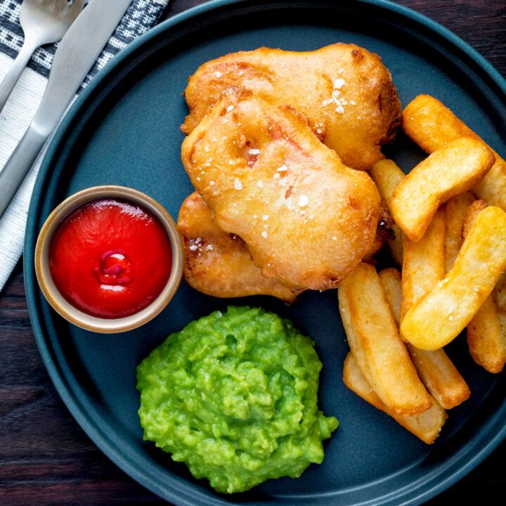 Crispy fried spam fritters in beer batter served with chips, mushy peas and ketchup.