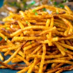 Close up crispy fried straw or matchstick potatoes.