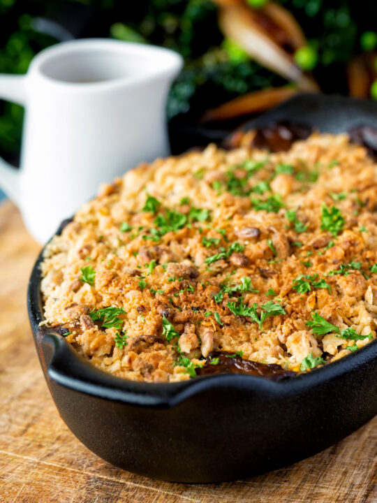 Root vegetable crumble with an oaty crumb in a vegan gravy.