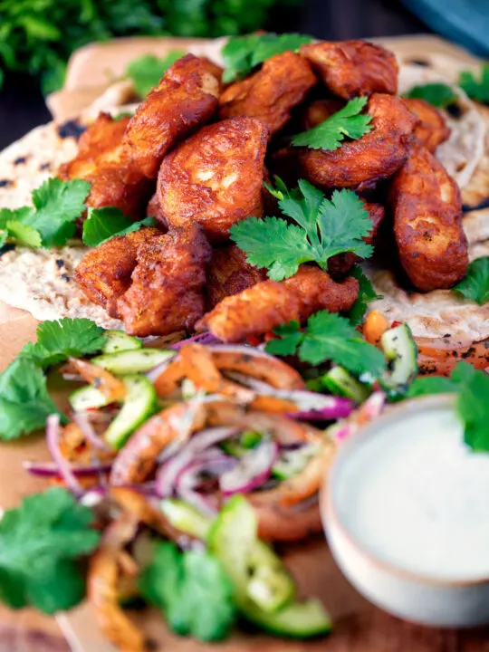 Amritsari fish pakora served with chapatis, chunky kachumber salad and raita.