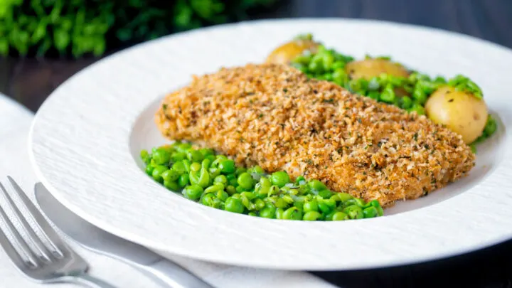 Baked cod loin in panko breadcrumbs with new potatoes and crushed minted peas.