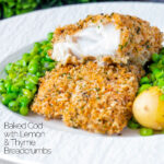 Baked cod loin in crispy panko breadcrumbs cut open to show flaky white fish featuring a title overlay.