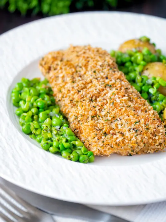 Baked cod loin in crispy panko breadcrumbs with crushed minted peas and potatoes.