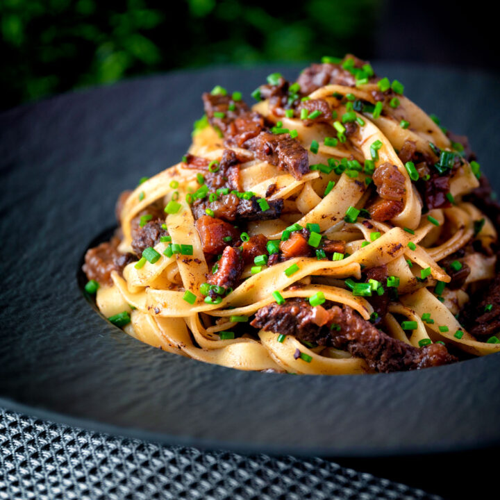 Slow cooked beef or ox cheek ragu served with pappardelle pasta and snipped chives.