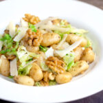 Cabbage and walnut gnocchi served with parmesan shavings.
