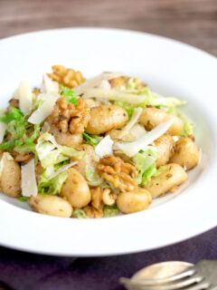 Cabbage and walnut gnocchi served with parmesan shavings.