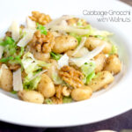 Cabbage and walnut gnocchi served with parmesan shavings featuring a title overlay.