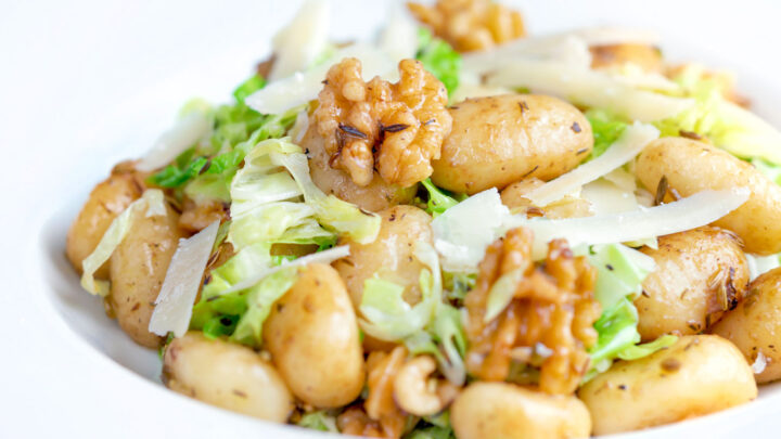 Cabbage gnocchi with fennel seeds and balsamic vinegar served with parmesan shavings.