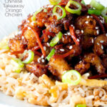 Close up Chinese takeaway style crispy orange chicken with egg fried rice featuring a title overlay.