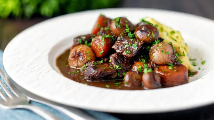 Instant Pot beef bourguignon or burgundy with carrots, mushrooms & pearl onions.