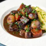 Instant Pot beef bourguignon or burgundy served with mashed potatoes.