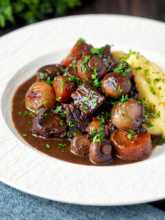 Instant Pot beef bourguignon or burgundy served with mashed potatoes.