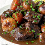 Close up Instant Pot beef bourguignon or burgundy featuring a title overlay.