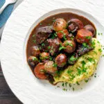 Overhead Instant Pot beef bourguignon or burgundy served with mashed potatoes.