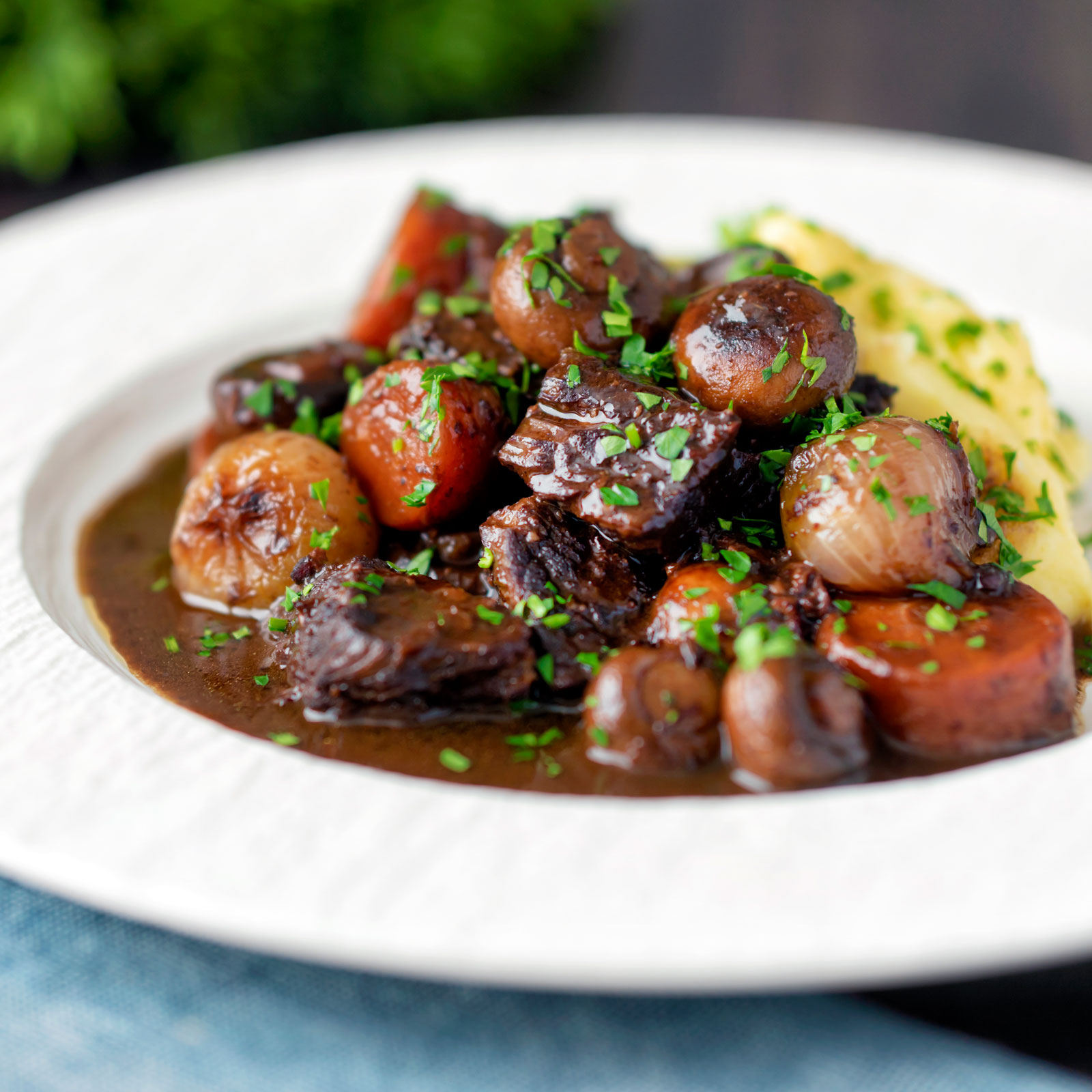 Instant Pot beef bourguignon or burgundy with carrots, mushrooms & pearl onions.