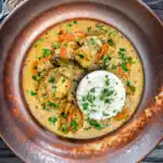 Overhead South Indian influenced monkfish curry with coconut milk.