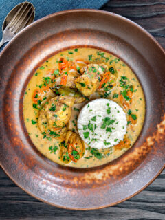 Overhead South Indian influenced monkfish curry with coconut milk.
