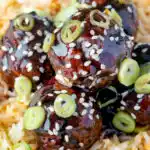 Close up easy teriyaki glazed beef meatballs with egg fried rice featuring a title overlay.