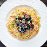Overhead easy teriyaki glazed beef meatballs with egg fried rice.