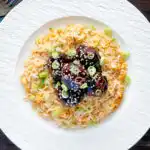 Overhead easy teriyaki glazed beef meatballs with egg fried rice.