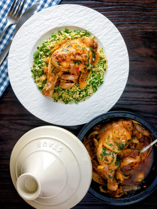 Overhead chicken tagine with preserved lemon served with bulgur wheat.