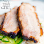 Sliced crispy Chinese Pork Belly served with rice and pickled cucumbers featuring a title overlay.