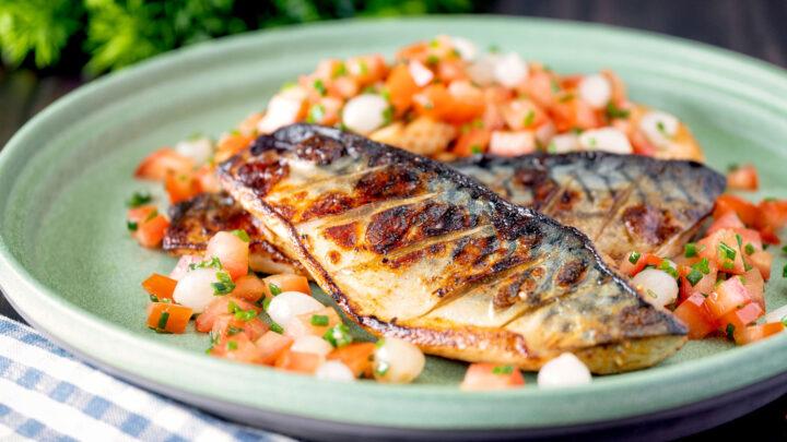 Devilled mackerel fillets served with a pickled pearl onion and tomato salad.