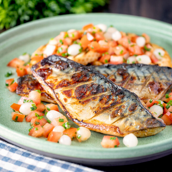 Devilled mackerel fillets served with a pickled pearl onion and tomato salad.