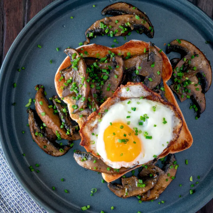 Devilled mushrooms on toast served with a fried egg and snipped chives.